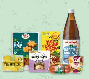 Das Bild zeigt eine Auswahl an Bio-veganen Produkten wie Käse, Joghurt und Getränke.